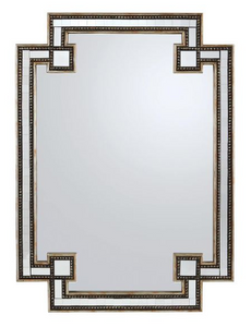 A decorative mirror with a detailed gold frame