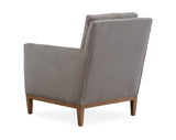 A gray fabric chair with tapered wooden legs